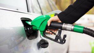 hand-holding-fuel-pump-and-refilling-car-at-petrol-station