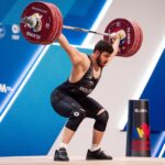 Тудор Брату на пьедестале с бронзовыми медалями на чемпионате Европы по тяжёлой атлетике